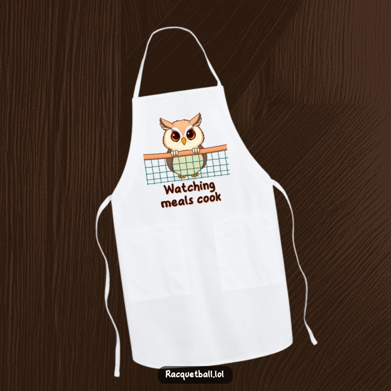 Funny Owl Apron: A chef owl comically peeking from behind a racquetball net, adding a humorous touch to kitchen wear.