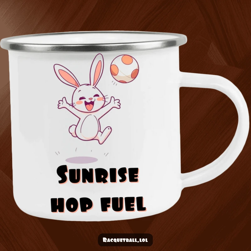 Funny camping mug showing a cheerful bunny character leaping high to hit a floating ball, outdoor adventure.