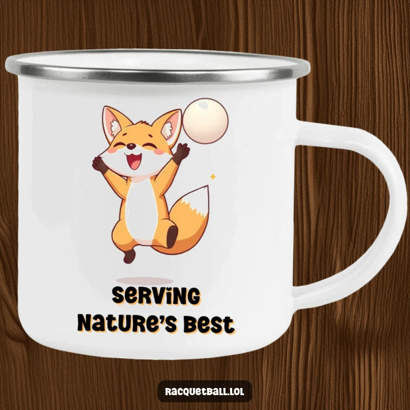 Funny fox jumping camping mug depicting a delighted fox leaping high to hit a floating ball, perfect for outdoor adventures.