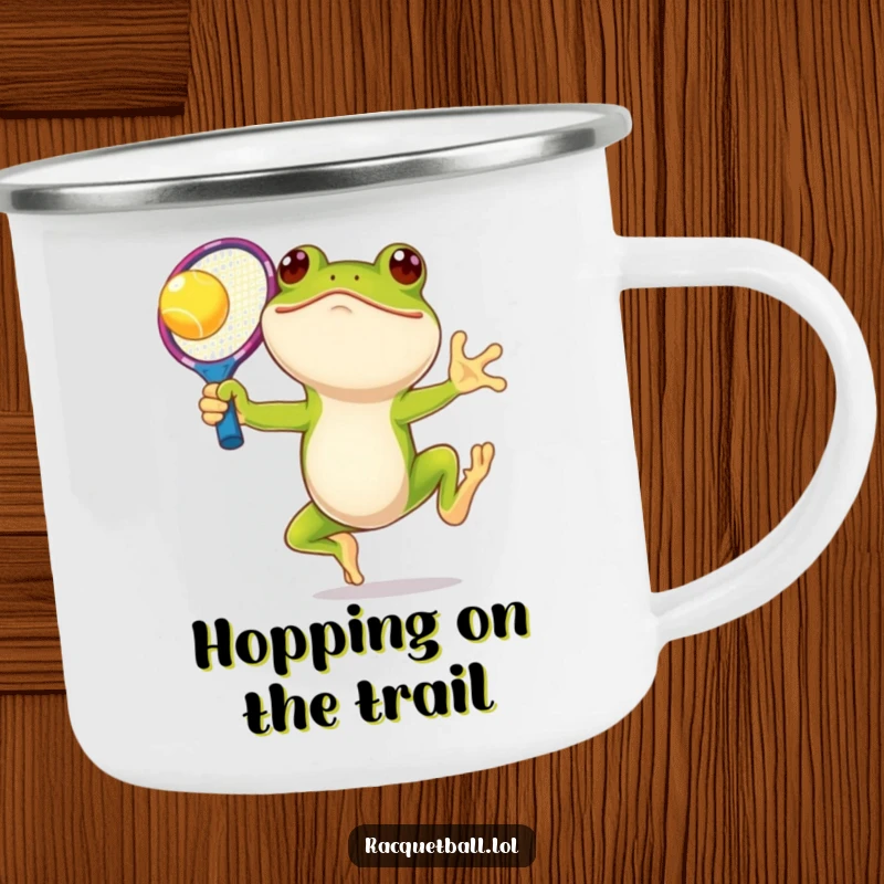 Funny frog tennis camping mug, a smiling amphibian leaping with an oversized racquet, ready for outdoor fun and warm beverages.