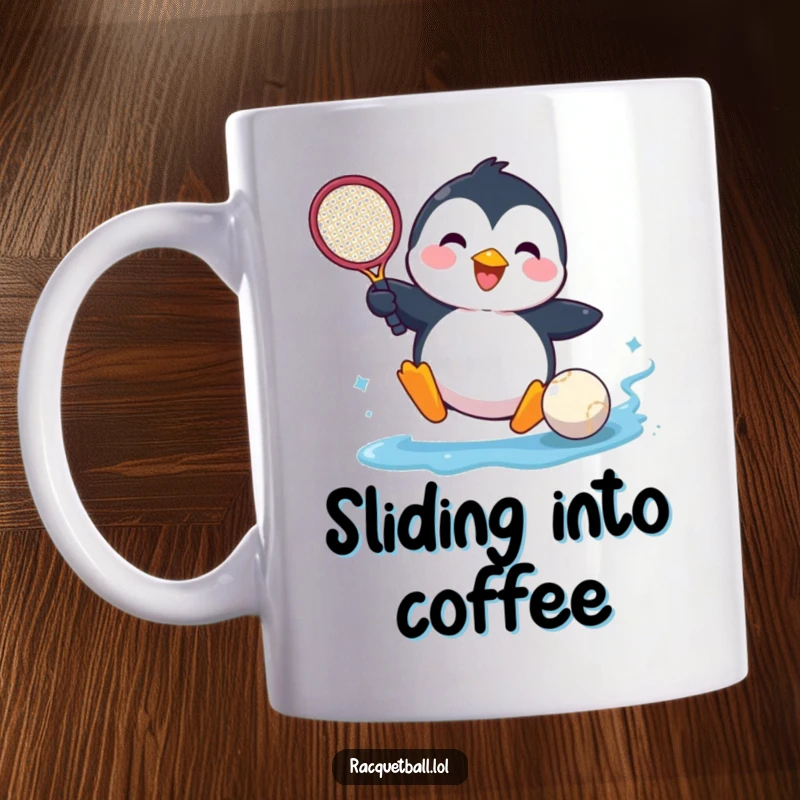 Funny mug showing a happy penguin comically sliding into a tennis ball with a racquet, expressing pure joy and determination.