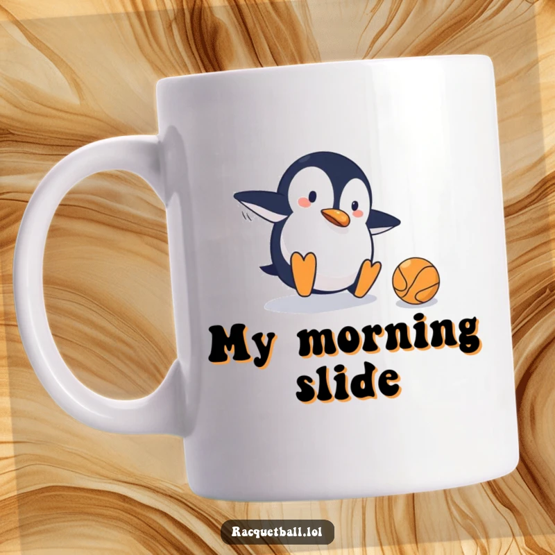 Funny mug depicting a clumsy penguin sliding on a tennis court, comically missing the ball, capturing a moment of humorous athletic failure.