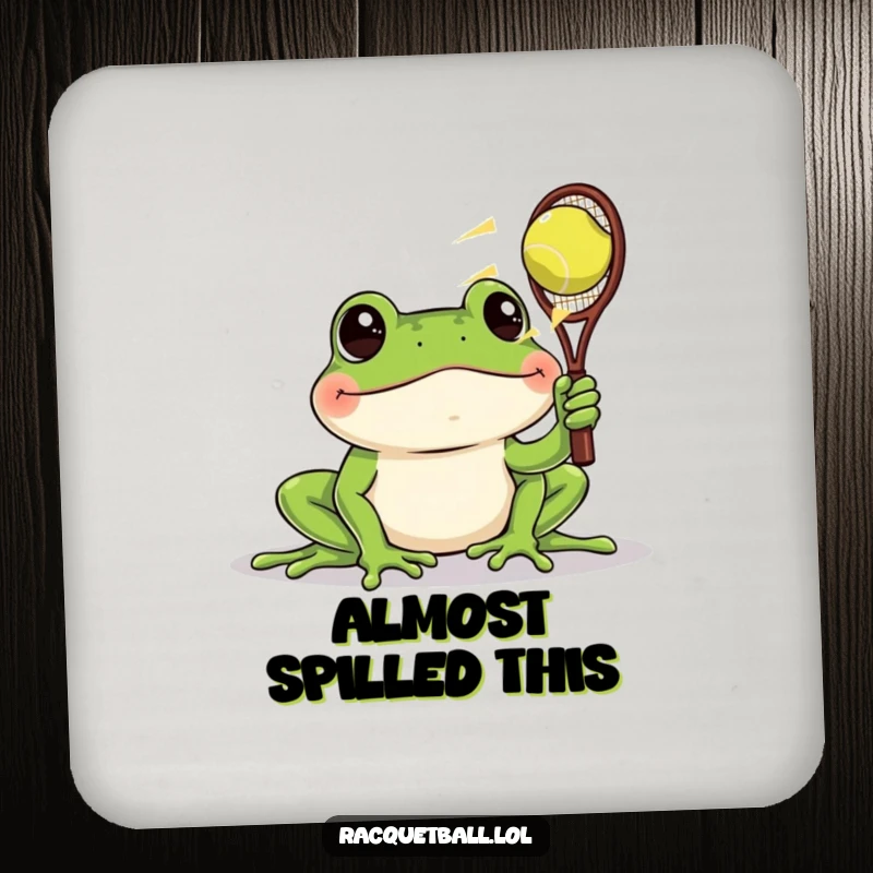 Funny drink coaster featuring a frog with wide eyes watching a racquetball zoom past, protecting surfaces with humorous surprise.