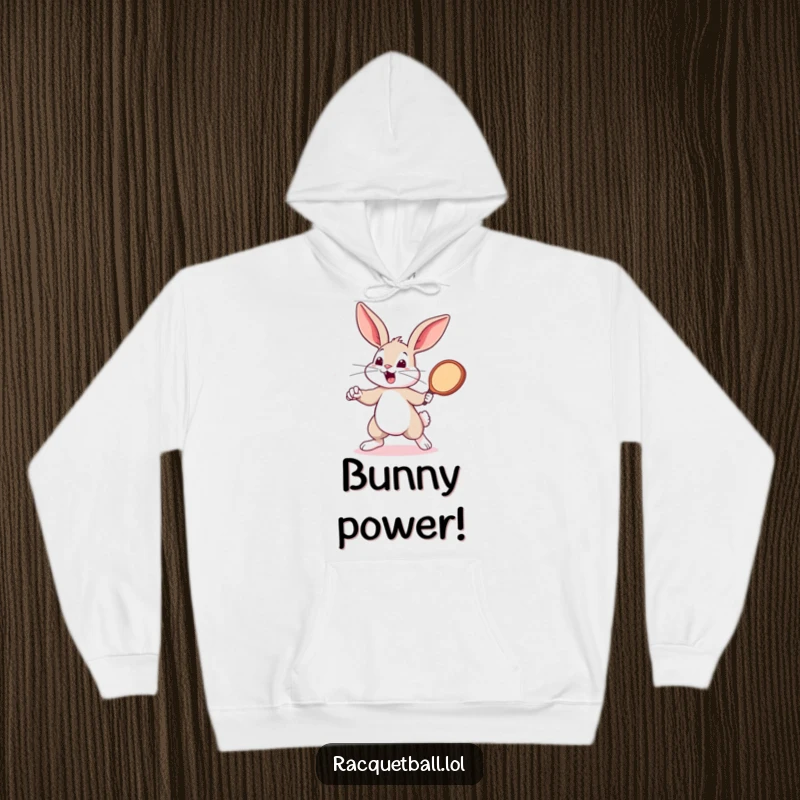 Funny bouncing bunny with a tiny racquetball paddle, ready to compete. A fun funny gift for players.
