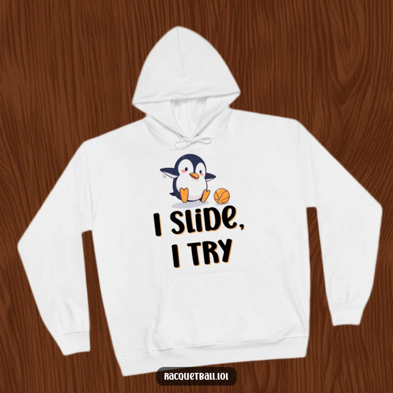 Funny hoodie featuring a clumsy penguin mid-slide on a tennis court, comically failing to hit the ball, perfect for casual wear.