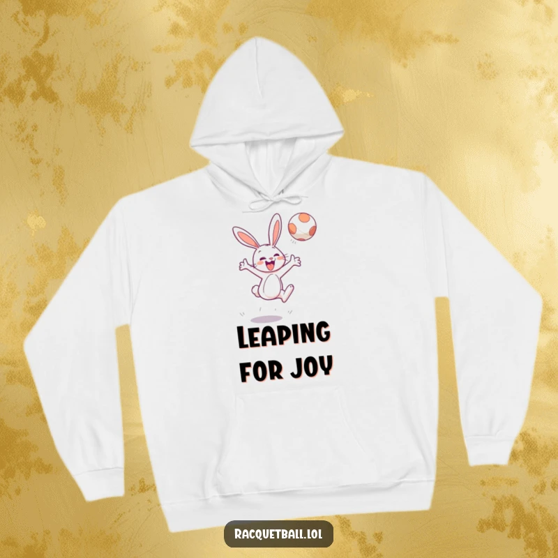 Funny hoodie featuring a cheerful bunny character leaping high to hit a floating ball with gusto, cozy fun.