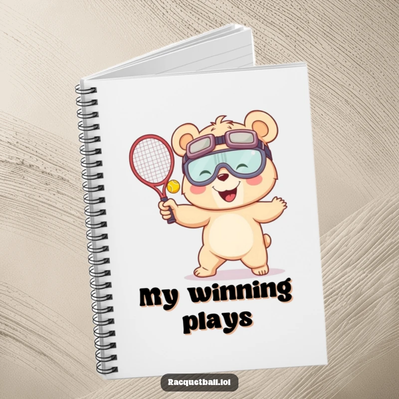 Funny notebook cover with a giggling bear in oversized goggles serving a racquetball, designed to inspire creative thoughts with a humorous sporty theme.