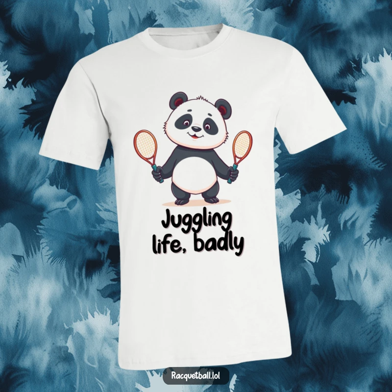Funny t-shirt featuring a curious panda comically attempting to juggle two tennis racquets, showcasing a moment of athletic struggle.